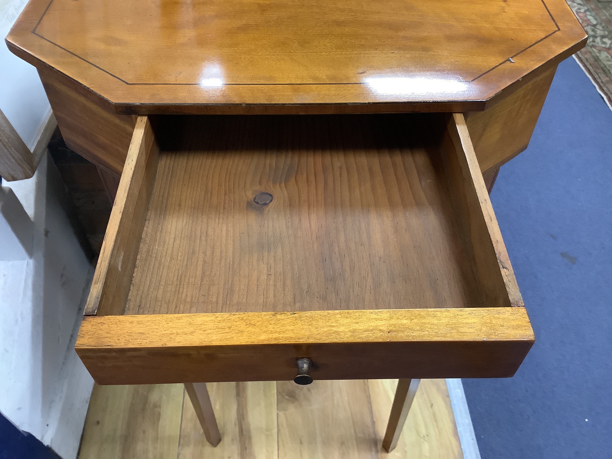 A Sheraton style octagonal satinwood sewing table. W-41, D-33, H-73cm.